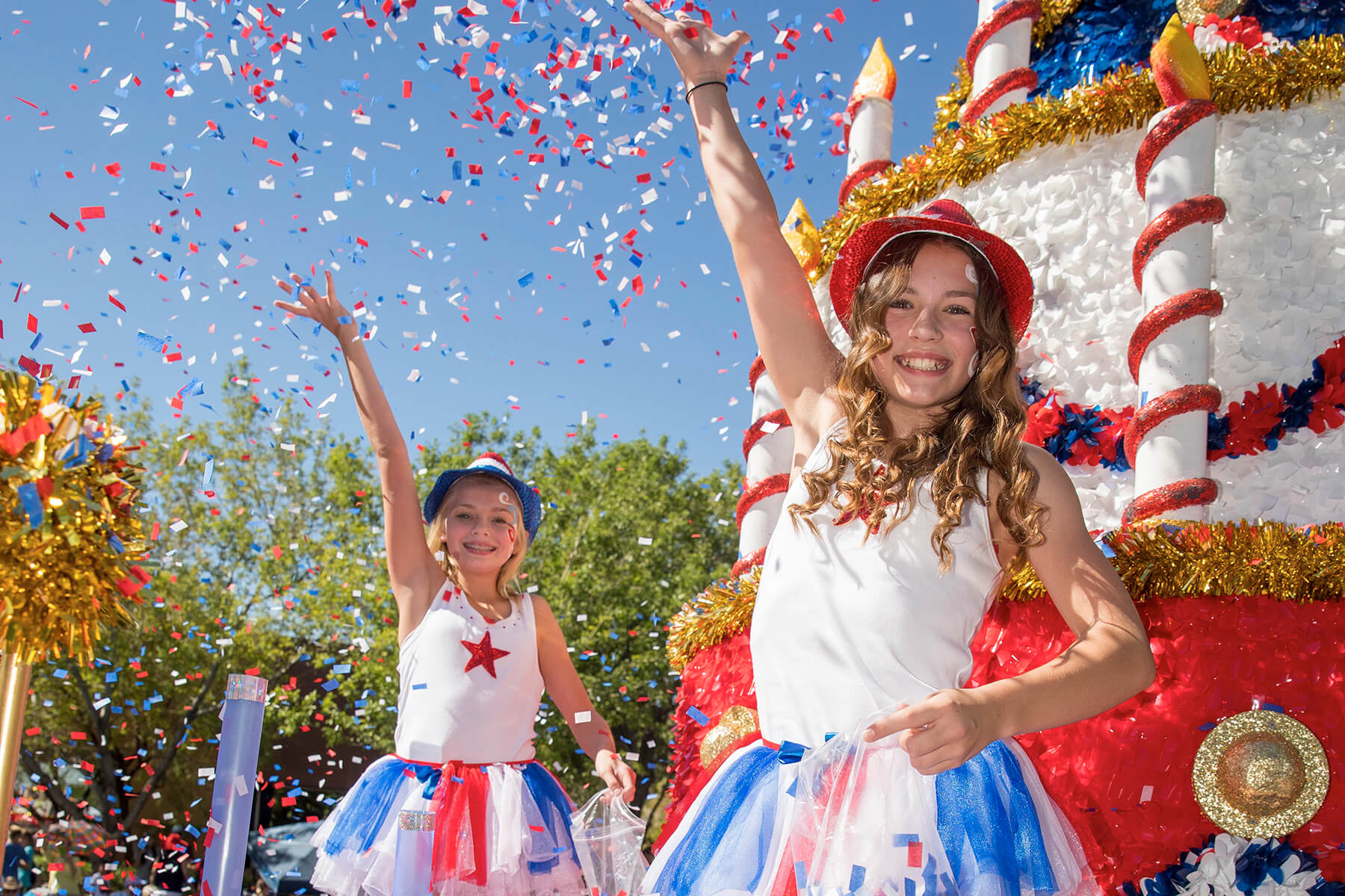 Float walkers toss confetti during the Summerlin Patriotic Parade